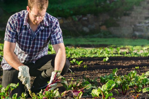 Team member preparing tools at the start of a garden maintenance shift